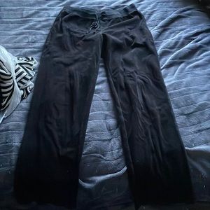 Velvet material black tracksuit pants.